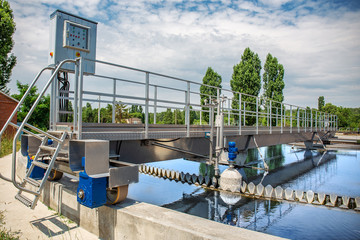 Modern wastewater treatment plant with round ponds for recycle dirty sewage water - obrazy, fototapety, plakaty