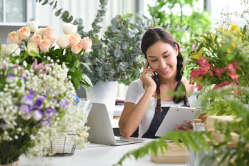 Young Asian woman entrepreneur/shop owner/ florist of a small flower shop business