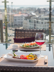 Sky cafe on the roof terrace with view of modern city