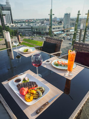 Sky cafe on the roof terrace with view of modern city
