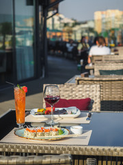 Sky cafe on the roof terrace with view of modern city