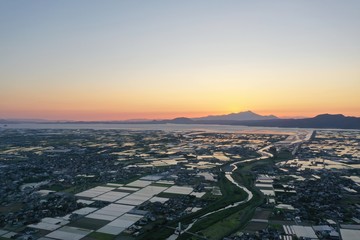 Sunset seen from a vast plain
