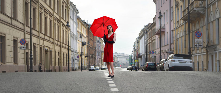 Girl in a red dress on Millionnaya street in St. Petersburg