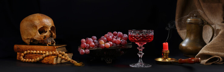 Skull, vase with grapes, a glass of wine and a candle extinguished