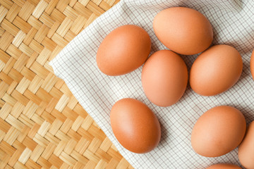 Brown eggs lay on a white plaid fabric. Food concept for weight loss.