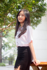 Portrait of thai adult student university uniform beautiful girl relax and smile