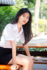 Portrait of thai adult student university uniform beautiful girl relax and smile