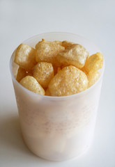 Cattle skin crackers on white background.