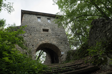 Fototapeta premium Lookout tower stands at the entrance of Muráň Castle in Slovakia. The ongoing renovation of the castle ruins is co-funded by EU, aiming to preserve the cultural heritage by employing local population.