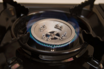 Closeup of burning gas on the kitchen gas stove.