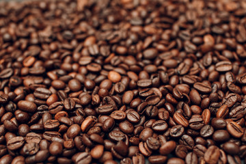 Obraz premium Roasted coffee beans brown seeds texture background wallpaper.