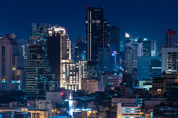 Bangkok business district city skyline at night.