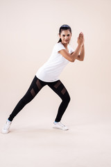 The young woman doing Zumba dance workout,by clapping hand and point toe down,fbasic pattern for exercise,