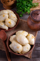 Russian, Ukrainian or Polish dish: varenyky, vareniki, pierogi, pyrohy. Dumplings, ffilled with cabbage