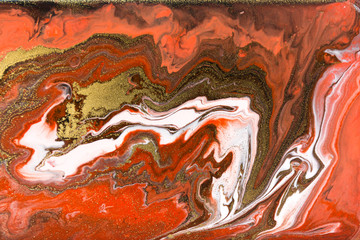 Red and gold marbling pattern. Golden marble liquid texture.