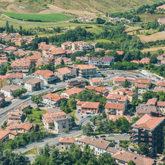 Fototapeta na wymiar Panorama of Republic of San Marino. San Marino Suburban districts and Italian hills view from above. 
