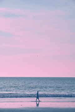 Girl on the beach during sunset