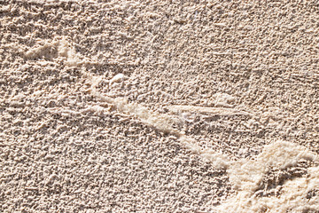 Beige painted grunge wall rough texture