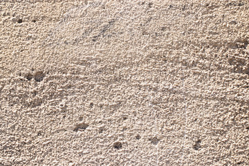 Beige painted grunge wall rough texture