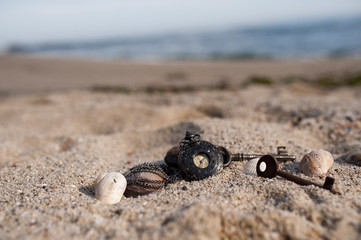 Pocket watch in sands on beach