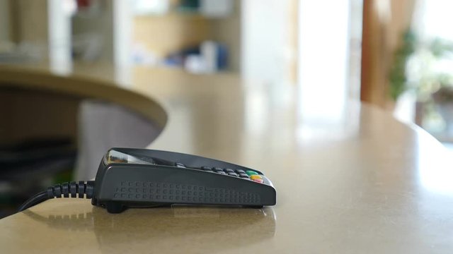 Closeup shot of a female Customer hand paying with NFC technology by smart watch contactless on terminal. 4k