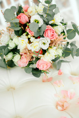 Diamond jewelry on a bridal bouquet.