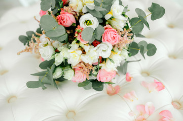 Diamond jewelry on a bridal bouquet.