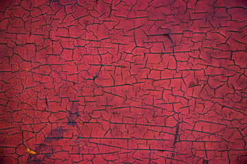 Red painted worn grunge vintage cracked weathered wall surface texture background