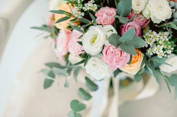 Diamond jewelry on a bridal bouquet.