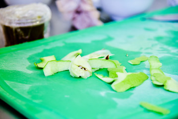 green apple peel on cutting board