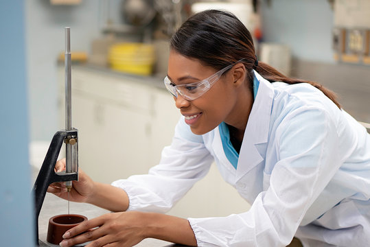 Scientist measuring liquid in lab