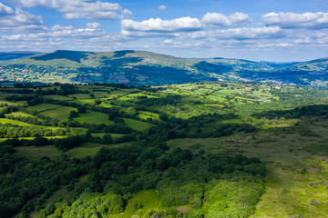Aerial drone view of beautiful green fields and farmland in rural South Wales
