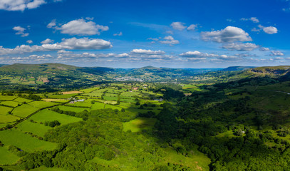Fototapeta na wymiar Aerial panorama of green fields and farmland in rural South Wales