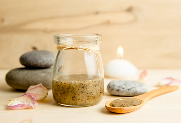 Selective focus on sauna honey scrub. Scrubbing honey and coffee mixture on body in hot sauna helps...
