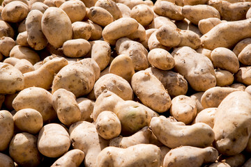 Potatoes piled up at a street market stall in Murcia city
