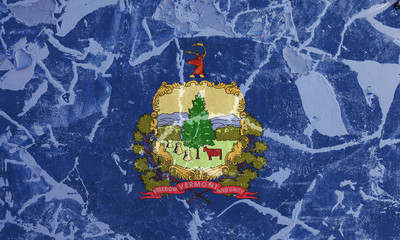 The national flag of the US state Vermont in against a gray wall with cracks and faults on the day of independence in colors of blue and yellow. Political and religious disputes, customs and delivery.