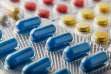 Tablets in large quantities. Images for the pharmaceutical industry. The concept of medicine.