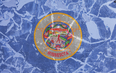 The national flag of the US state Minnesota in against a gray wall with cracks and faults on the day of independence in blue red and yellow. Political and religious disputes, customs and delivery.