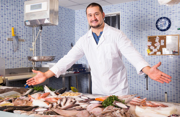 Man standing near fish