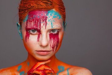 Portrait of a model in an expressive creative style using an unusual make-up