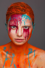 Portrait of a model in an expressive creative style using an unusual make-up