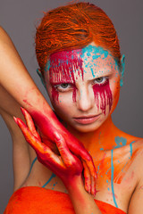 Portrait of a model in an expressive creative style using an unusual make-up
