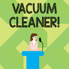 Writing note showing Vacuum Cleaner. Business concept for machine that cleans floors and surfaces by sucking up dust Businesswoman Behind Podium Rostrum Speaking on Microphone