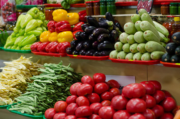 big choice of fresh fruits and vegetables on market counter