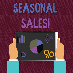 Text sign showing Seasonal Sales. Business photo text Discount which is offered on goods at particular seasons Hands Holding Tablet with Search Engine Optimization Driver Icons on Screen