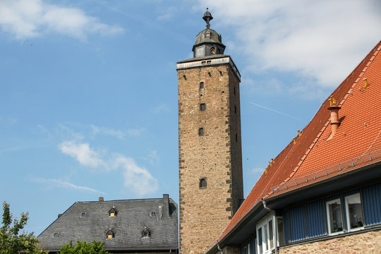 Steeple with background blue sky and little clouds in Steinau in Germany