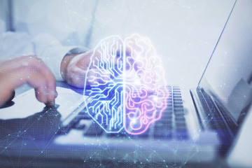 Man typing on keyboard background with brain hologram. Concept of big Data.