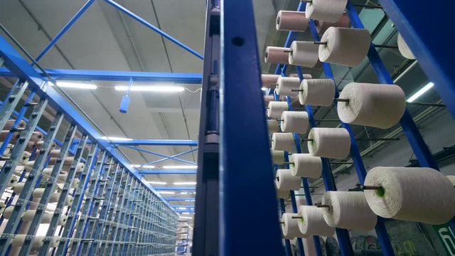 Passage of a clothing factory filled with equipment. Textiles Production Line