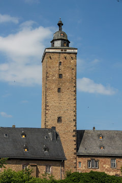 Steeple with background blue sky and little clouds in Steinau in Germany