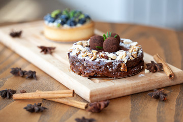 Table with yeasty sweet pastry with fresh cherries and streusel topping, cup of tea and few cubes of sugar. Summer fresh fruit appetizer